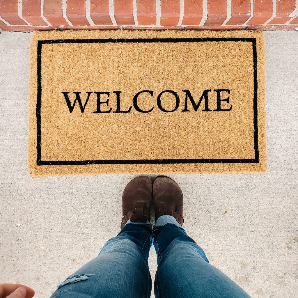 spring cleaning home maintenance check list replace welcome mats with new springtime decor