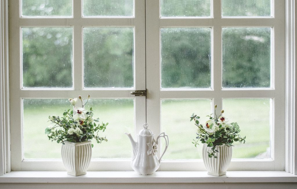 spring cleaning home maintenance for homeowners clean inside and outside of windows, repair or replace window screens